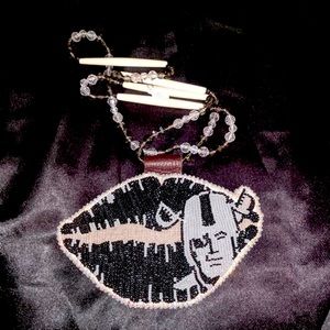 Handmade beadwork NFL Raiders kiss medallion